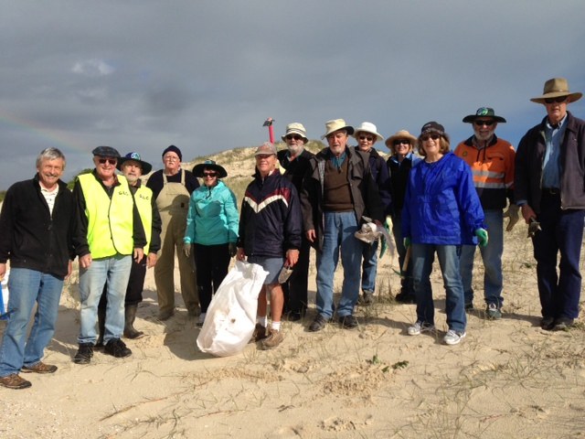 Bitou Busters having fun planting on the dunes. 