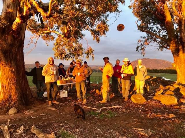 Landcare volunteers having teabreak under the trees